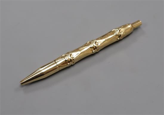 A Cartier style 14ct yellow metal bamboo pattern ballpoint pen.